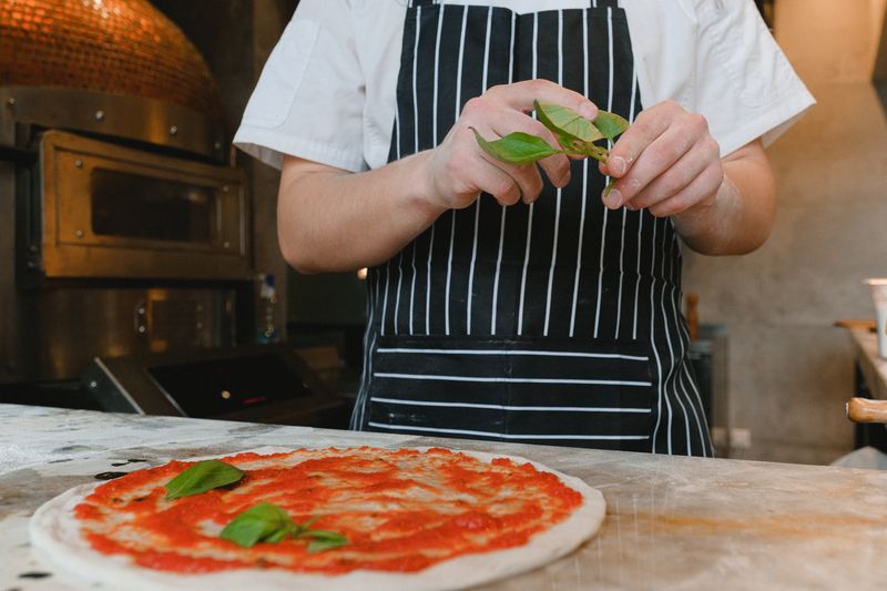 mod pizza kitchen — fresh ingredients being prepared